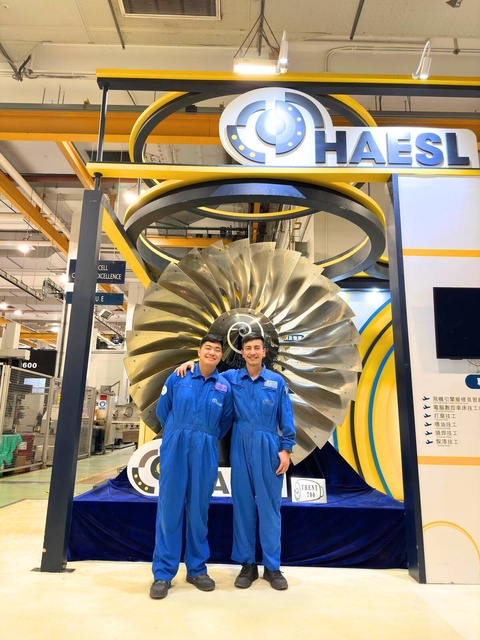 Engineer inspecting aero engine