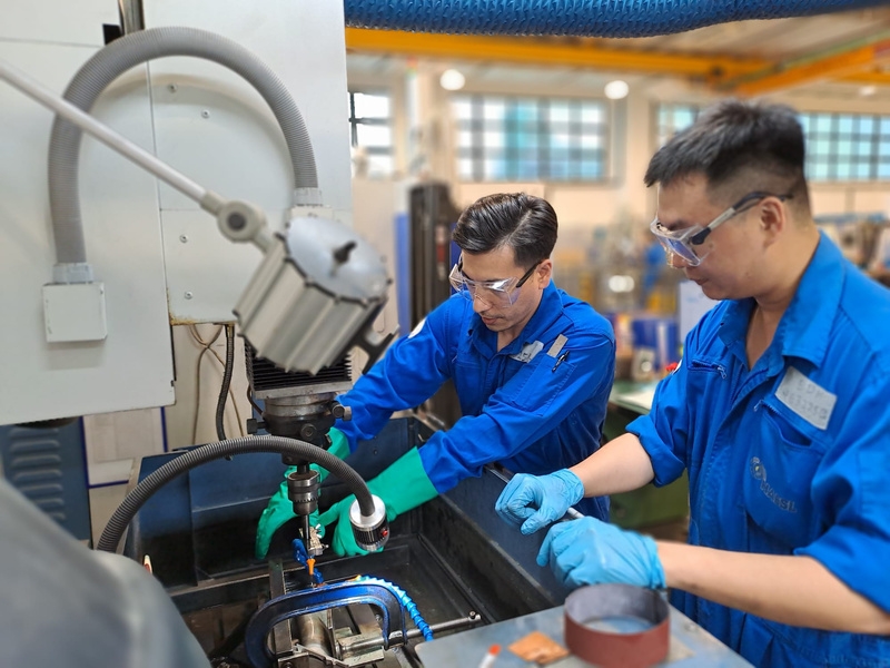 Engineer inspecting aero engine