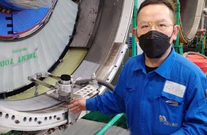 Engineer inspecting aero engine