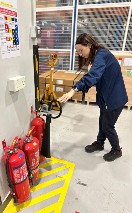HAESL employee checking fire safety equipment